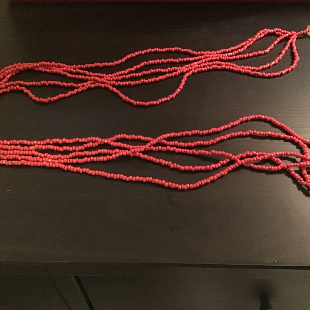Long strand of red beads. Hawaii